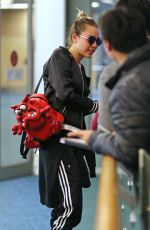 MILEY CYRUS at Vancouver International Airport 12/14/2015