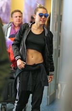 MILEY CYRUS at Vancouver International Airport 12/14/2015