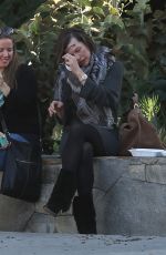 MILLA JOVOVICH at The Melrose Place Farmers Market in West Hollywood 12/20/2015
