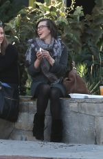 MILLA JOVOVICH at The Melrose Place Farmers Market in West Hollywood 12/20/2015