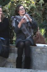 MILLA JOVOVICH at The Melrose Place Farmers Market in West Hollywood 12/20/2015
