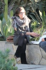 MILLA JOVOVICH at The Melrose Place Farmers Market in West Hollywood 12/20/2015