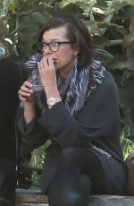 MILLA JOVOVICH at The Melrose Place Farmers Market in West Hollywood 12/20/2015