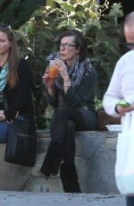 MILLA JOVOVICH at The Melrose Place Farmers Market in West Hollywood 12/20/2015