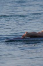 OLIVIA WILDE in Bikini Paddleboarding in Maui 12/14/2015