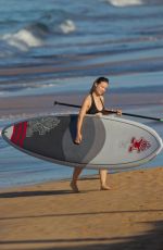 OLIVIA WILDE in Bikini Paddleboarding in Maui 12/14/2015