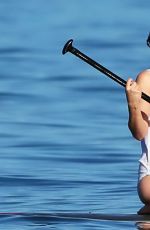 OLIVIA WILDE in Bikini Paddleboarding in Maui 12/19/2015
