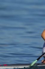OLIVIA WILDE in Bikini Paddleboarding in Maui 12/19/2015