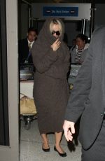 PAMELA ANDERSON at LAX Airport in Los Angeles 12/09/2015