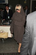 PAMELA ANDERSON at LAX Airport in Los Angeles 12/09/2015
