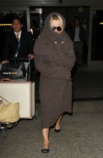 PAMELA ANDERSON at LAX Airport in Los Angeles 12/09/2015
