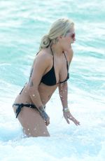 RITA ORA in Black Bikini at a Beach in Miami 12/28/2015