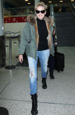 SHARON STONE in Ripped Jeans at LAX Airport in Los Angeles 12/28/2015