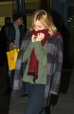 SIENNA MILLER at Heathrow Airport in London 12/14/2015