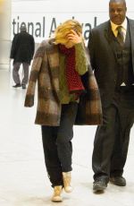 SIENNA MILLER at Heathrow Airport in London 12/14/2015