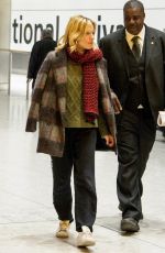 SIENNA MILLER at Heathrow Airport in London 12/14/2015