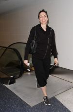 WHITNEY CUMMINGS Make-up Free at LAX Airport in Los Angeles 12/22/2015