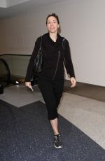 WHITNEY CUMMINGS Make-up Free at LAX Airport in Los Angeles 12/22/2015