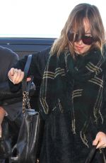 /DAKOTA JOHNSON Arrives at LAX Airport in Los Angeles 01/07/2016