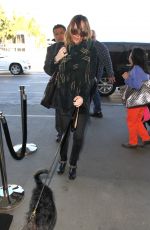 /DAKOTA JOHNSON Arrives at LAX Airport in Los Angeles 01/07/2016