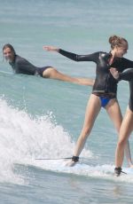 CARA DELEVINGNE and ANNIE CLARK Paddleboarding in Barbados 01/03/2016
