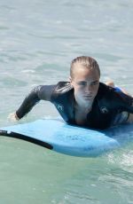 CARA DELEVINGNE and ANNIE CLARK Paddleboarding in Barbados 01/03/2016