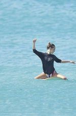 CARA DELEVINGNE and ANNIE CLARK Paddleboarding in Barbados 01/03/2016