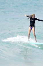 CARA DELEVINGNE and ANNIE CLARK Paddleboarding in Barbados 01/03/2016
