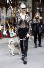 CARA DELEVINGNE at The Guitar Legend Store in Paris 01/26/2016