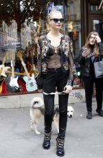 CARA DELEVINGNE at The Guitar Legend Store in Paris 01/26/2016