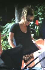 CAROLINE FLACK Relaxing at a Pool in Miami 01/04/2016