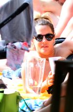 CAROLINE FLACK Relaxing at a Pool in Miami 01/04/2016
