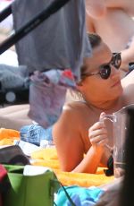 CAROLINE FLACK Relaxing at a Pool in Miami 01/04/2016