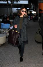EMILIA CLARKE at LAX Airport in Los Angeles 01/08/2016