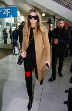 GIGI HADID at Charles De Gaulle Airport in Paris 01/19/2016