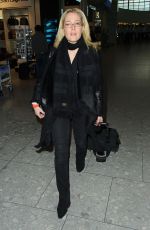 GILLIAN ANDERSON at Heathrow Airport in London 01/08/2016