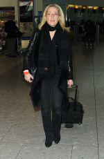 GILLIAN ANDERSON at Heathrow Airport in London 01/08/2016