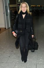 GILLIAN ANDERSON at Heathrow Airport in London 01/08/2016