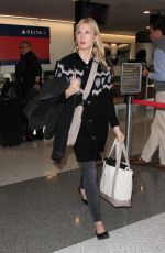KELLY RUTHERFORD at LAX Airport in Los Angeles 01/21/2016