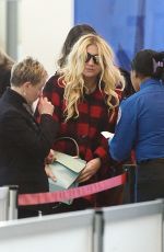 KESHA SEBERT Arrives at JFK Airport in New York 01/27/2016