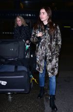 LILY COLLINS Arrives at LAX Airport in Los Angeles 01/06/2016
