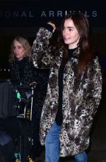 LILY COLLINS Arrives at LAX Airport in Los Angeles 01/06/2016