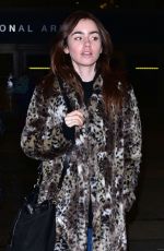 LILY COLLINS Arrives at LAX Airport in Los Angeles 01/06/2016