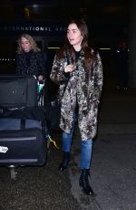 LILY COLLINS Arrives at LAX Airport in Los Angeles 01/06/2016