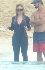 MARIAH CAREY in Wetsuit at a Boat in Caribbean 01/06/2016