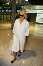 PAMELA ANDERSON Arrives at Roissy CDG Airport in Paris 01/19/2016