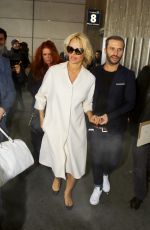 PAMELA ANDERSON Arrives at Roissy CDG Airport in Paris 01/19/2016