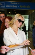 PAMELA ANDERSON Arrives at Roissy CDG Airport in Paris 01/19/2016
