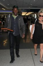 PAMELA ANDERSON at LAX Airport in Los Angeles 12/31/2015
