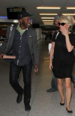 PAMELA ANDERSON at LAX Airport in Los Angeles 12/31/2015
